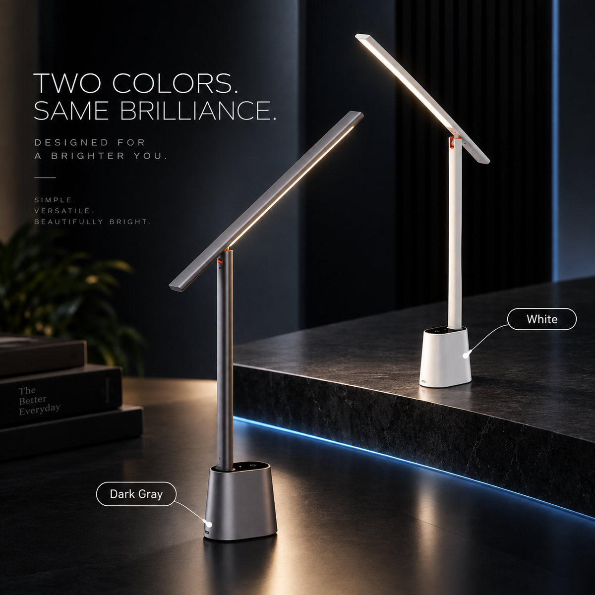 Two modern adjustable LED desk lamps shown on a dark tabletop in a styled interior setting. One lamp is labeled 'Dark Gray' and the other 'White', with text reading 'TWO COLORS.